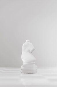 Chess knight piece representing the Stafford Gambit opening