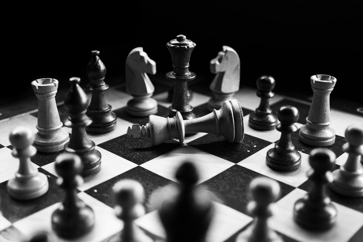 Fallen chess king representing the devastating result of the Stafford Gambit trap