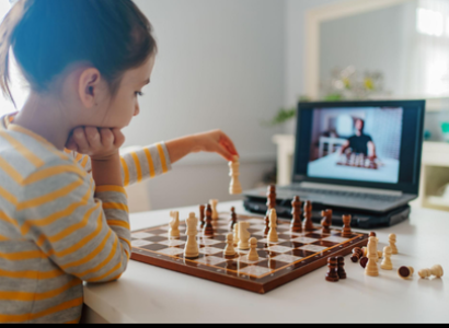 Chess coach teaching a child