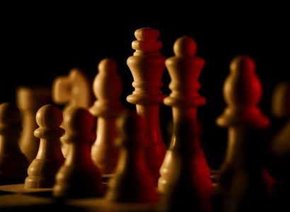 White chess pieces representing popular chess openings for White